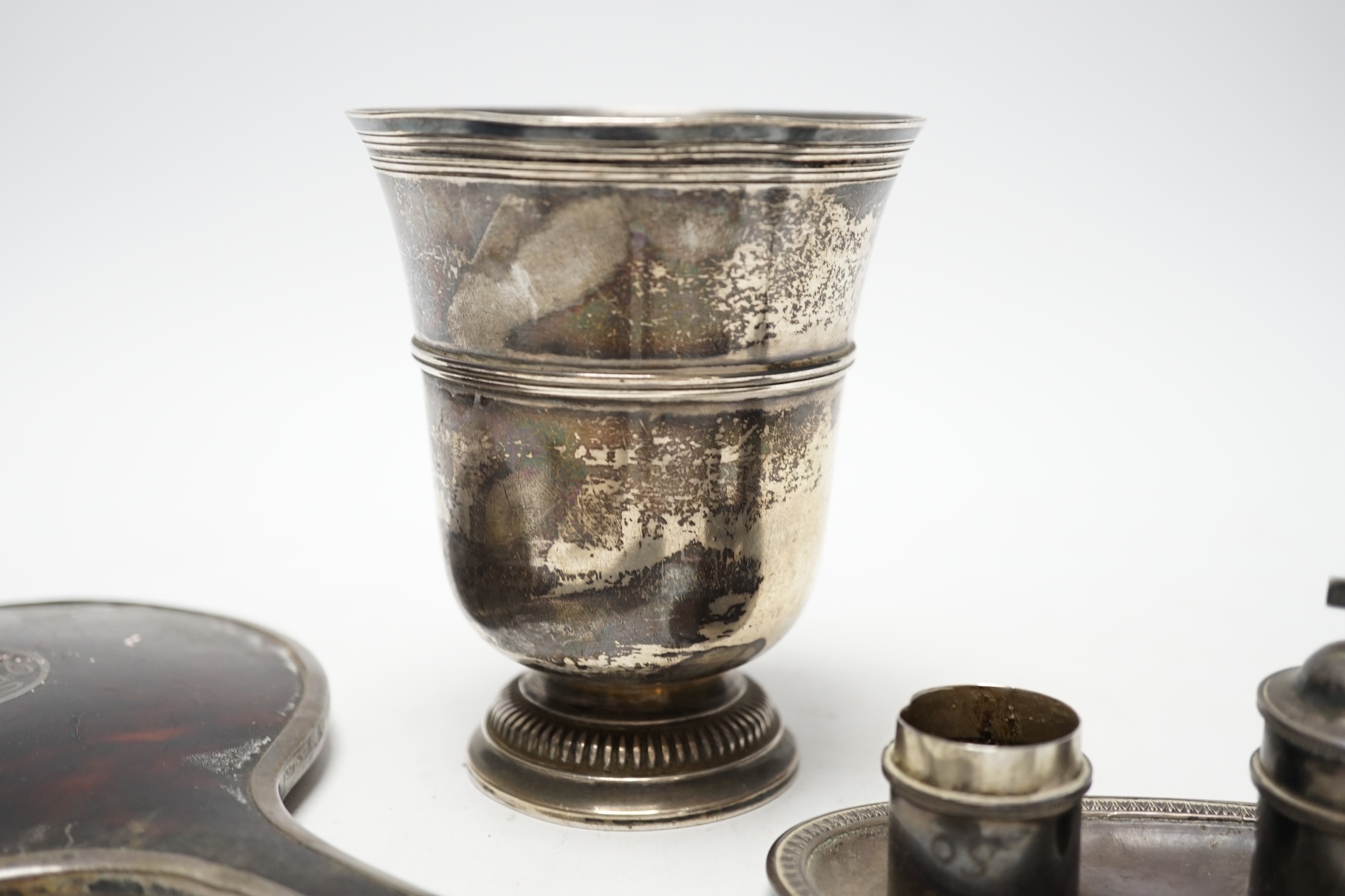 A French white metal small pedestal vase, 10.8cm, a silver and tortoiseshell mounted hand mirror and three other items including a pair of silver sugar tongs.